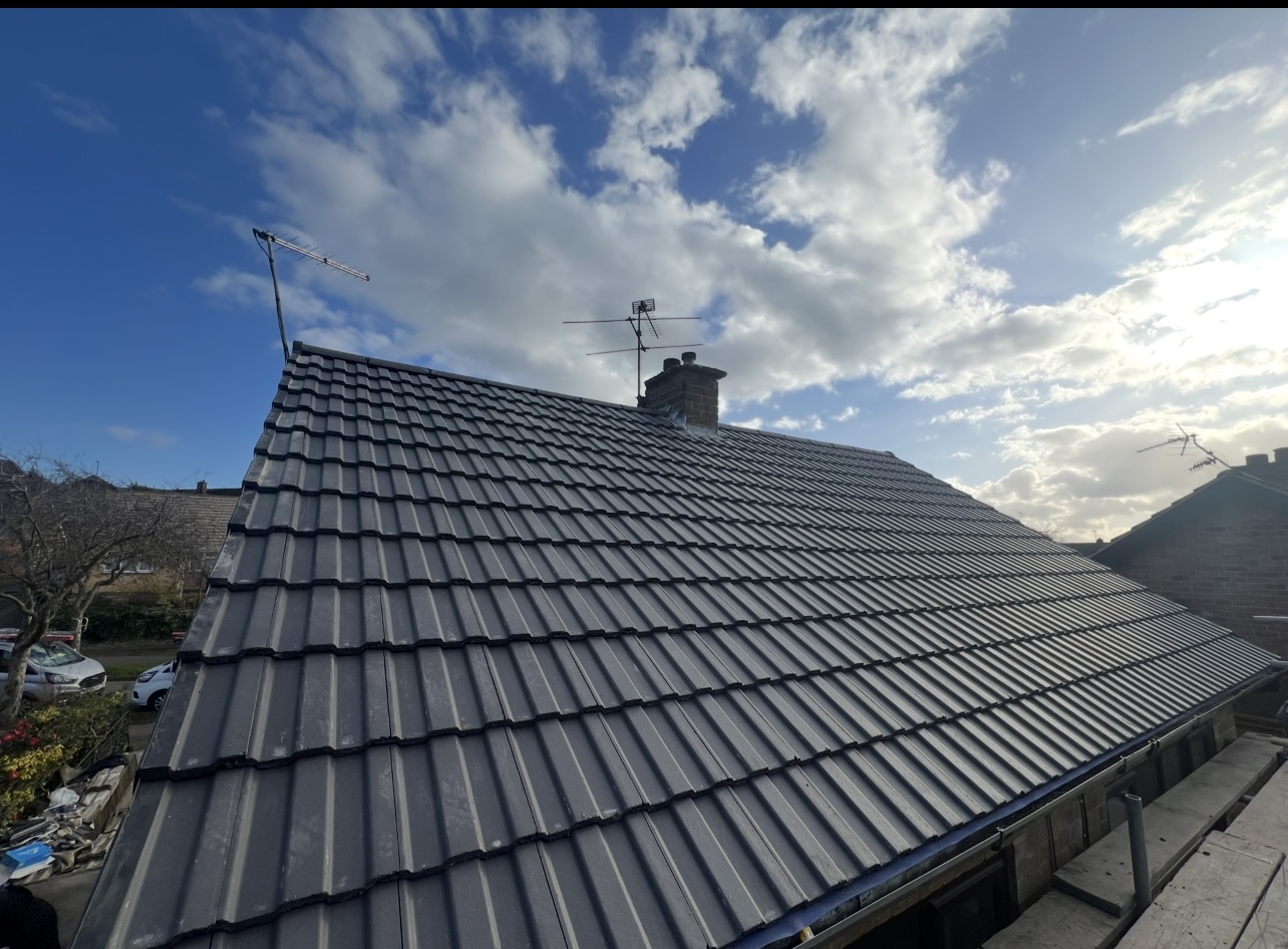 Dark tiled roof — First Choice Roofing project